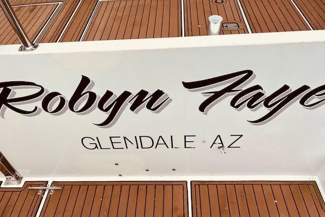 Slide: The Image of 1996 Forbes Cooper pilot house boat with "Robyn Faye" and "Glendale, AZ" on deck. - 4
