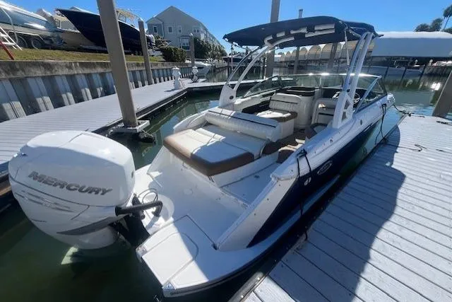 The Image of 2019 Cobalt 25SC boat docked, featuring a Mercury outboard motor and spacious seating. - 0