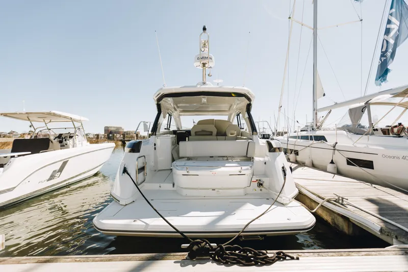 The Image of 2023 Beneteau Gran Turismo 41 yacht docked at marina, rear view. - 0