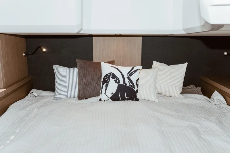 Slide: The Image of Luxurious cabin interior of 2023 Beneteau Gran Turismo 41 with stylish bedding and pillows. - 10