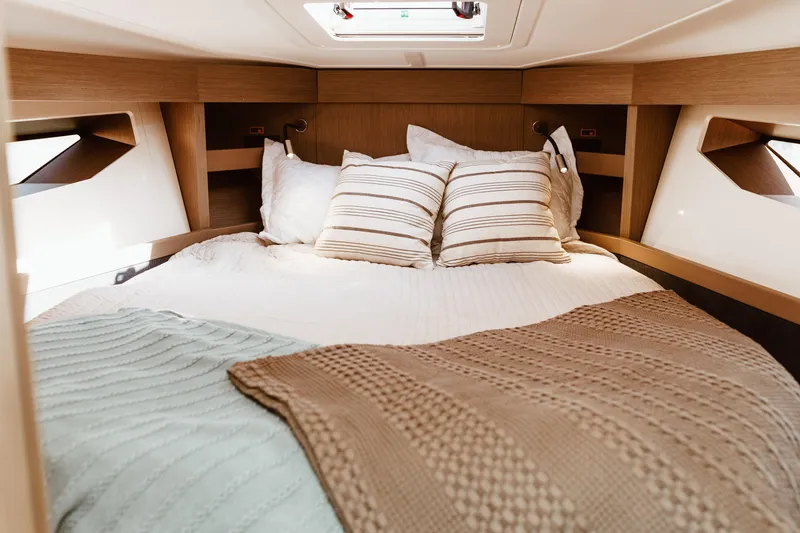Slide: The Image of Luxurious cabin interior of 2023 Beneteau Gran Turismo 41 yacht with cozy bedding. - 12