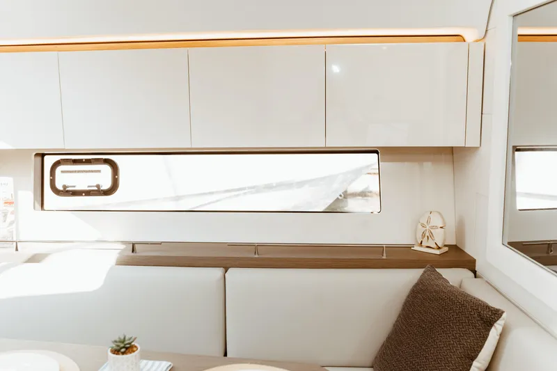 Slide: The Image of Luxurious interior of 2023 Beneteau Gran Turismo 41 yacht, featuring modern cabinetry and elegant decor. - 16
