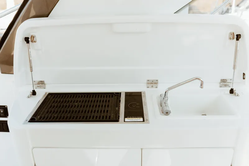Slide: The Image of Outdoor kitchen on 2023 Beneteau Gran Turismo 41 yacht with grill and sink. - 23