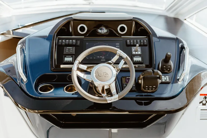 Slide: The Image of Cockpit of 2023 Beneteau Gran Turismo 41 with modern steering and controls. - 28