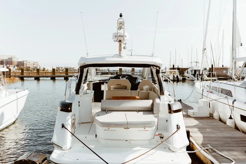 Slide: The Image of 2023 Beneteau Gran Turismo 41 yacht docked at marina, rear view. - 32