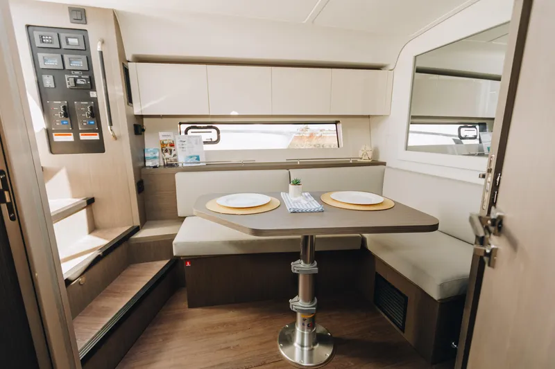 Slide: The Image of Interior of 2023 Beneteau Gran Turismo 41 yacht, featuring a modern dining area. - 6
