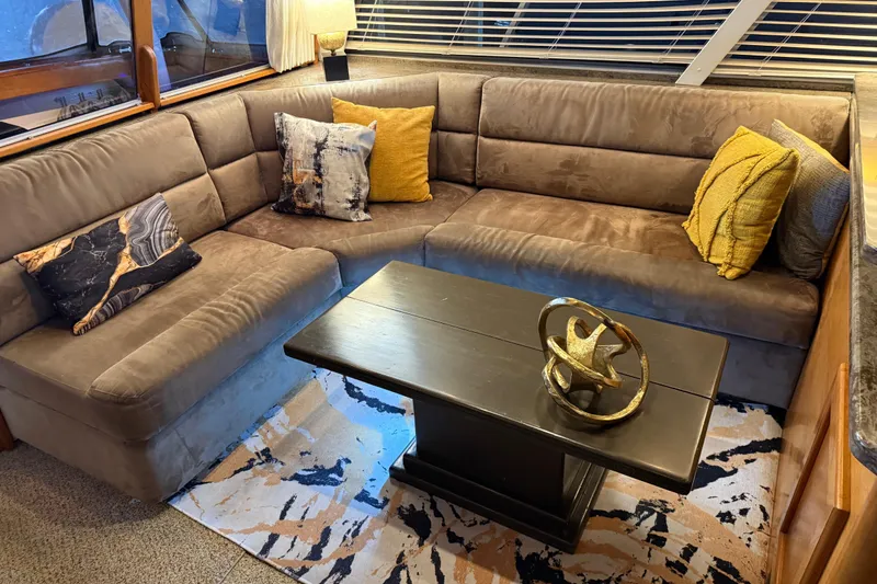 Slide: The Image of Interior of 1985 Bayliner 4550 Motoryacht with modern kitchen and cozy seating area. - 10