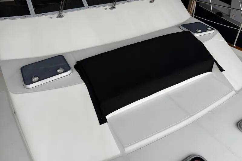 Slide: The Image of 1985 Bayliner 4550 Motoryacht docked, showcasing cabin interior and sleek exterior design. - 107