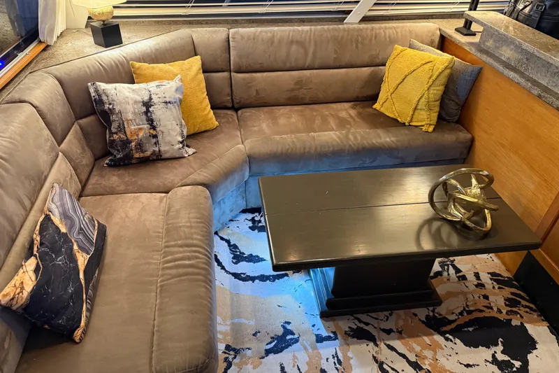 Slide: The Image of Interior of 1985 Bayliner 4550 Motoryacht with cozy seating and modern decor. - 11