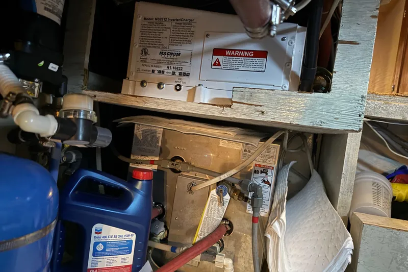 Slide: The Image of Engine room of 1985 Bayliner 4550 Motoryacht with fuel filters and hoses. - 114