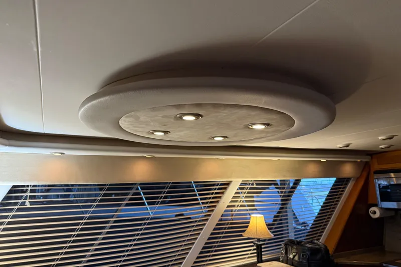 Slide: The Image of Luxurious interior of 1985 Bayliner 4550 Motoryacht with plush seating and decorative pillows. - 12