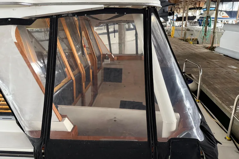 Slide: The Image of Interior view of 1985 Bayliner 4550 Motoryacht docked at marina. - 126