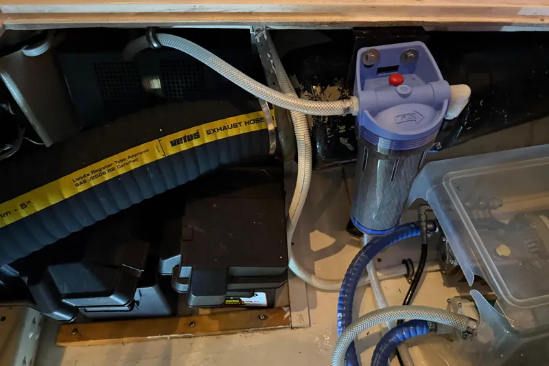 Slide: The Image of Engine compartment of 1985 Bayliner 4550 Motoryacht with tools and equipment. - 132