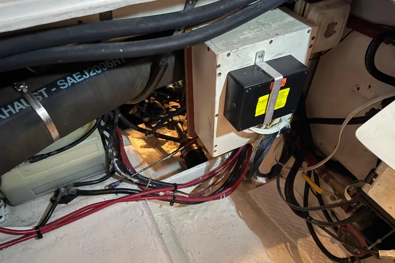 Slide: The Image of Engine compartment of 1985 Bayliner 4550 Motoryacht with exhaust hose and filtration system. - 134