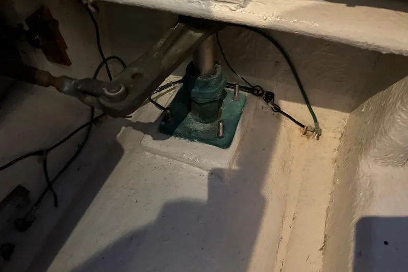 Slide: The Image of Engine room of 1985 Bayliner 4550 Motoryacht with visible hoses and equipment. - 135