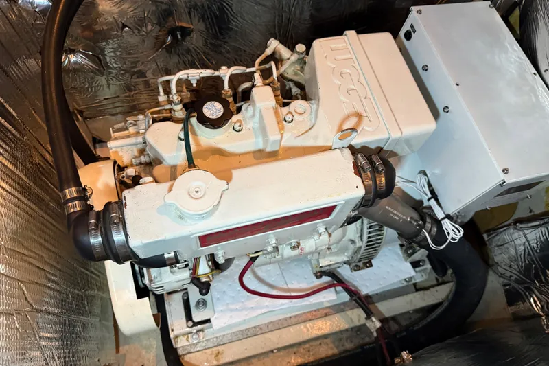 Slide: The Image of Engine compartment of 1985 Bayliner 4550 Motoryacht, showing mechanical components and wiring. - 137