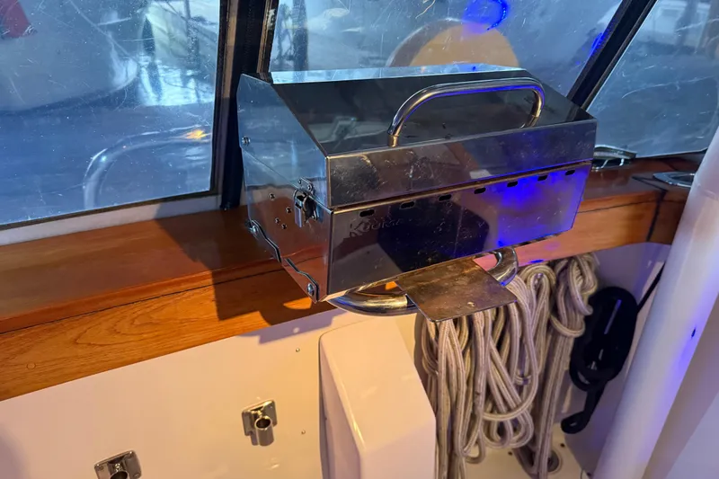 Slide: The Image of Interior of 1985 Bayliner 4550 Motoryacht with blue LED lights and wooden accents. - 143