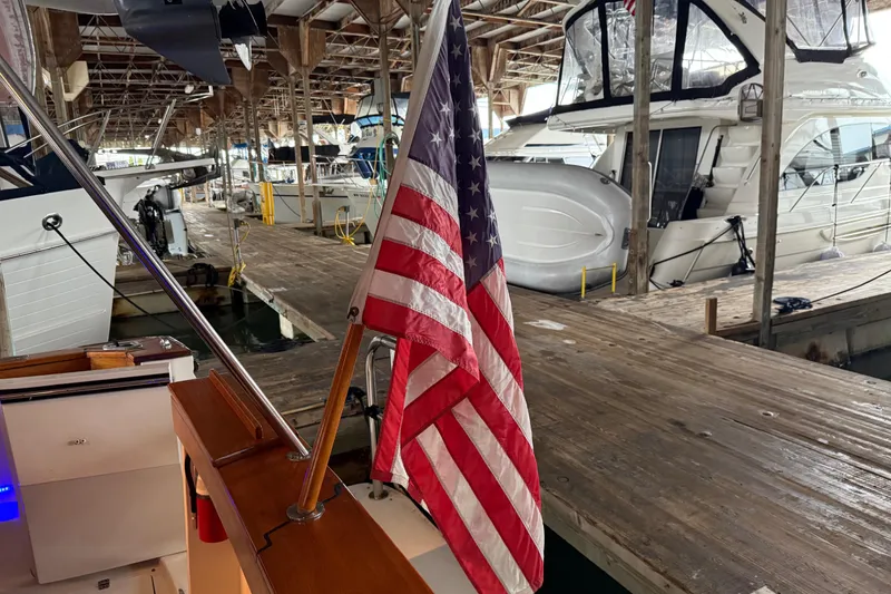 Slide: The Image of 1985 Bayliner 4550 Motoryacht interior with control panel and blue LED lighting. - 144