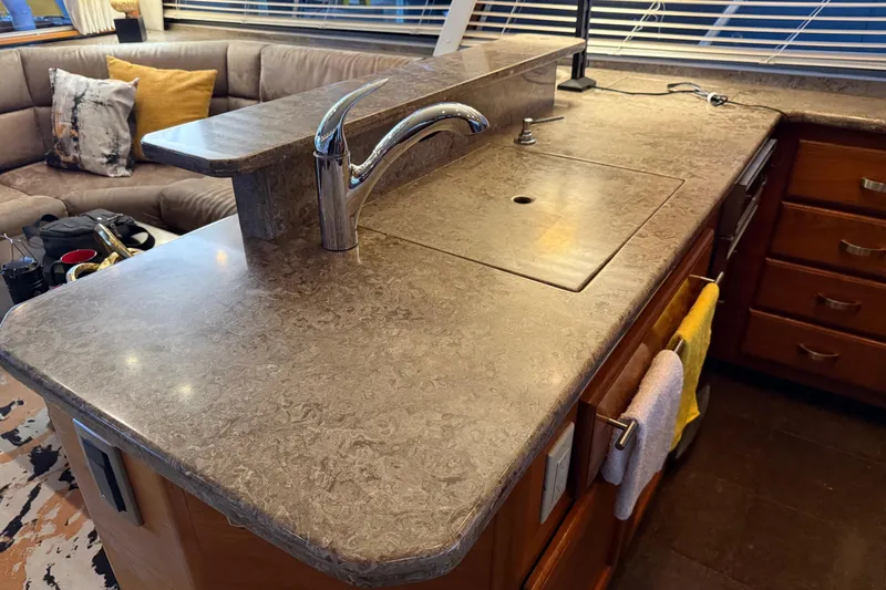 Slide: The Image of Luxurious interior of 1985 Bayliner 4550 Motoryacht with cozy seating and elegant lighting. - 26