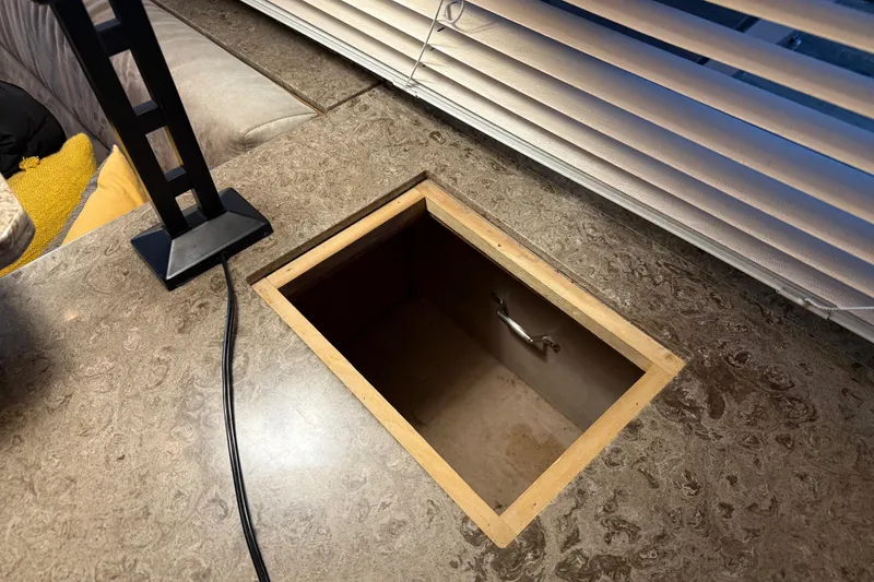 Slide: The Image of 1985 Bayliner 4550 Motoryacht interior with modern kitchen sink and cozy seating area. - 29