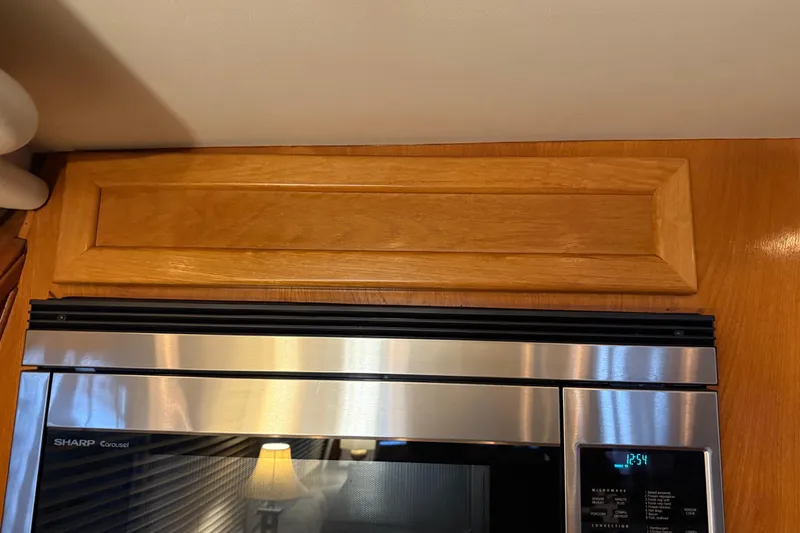 Slide: The Image of Electric stove in 1985 Bayliner 4550 Motoryacht kitchen, featuring three burners and oven. - 33