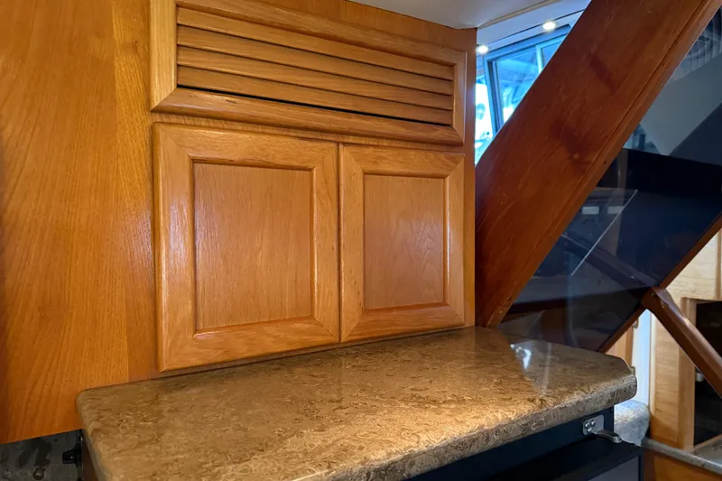 Slide: The Image of Microwave in 1985 Bayliner 4550 Motoryacht kitchen with wooden cabinetry. - 35