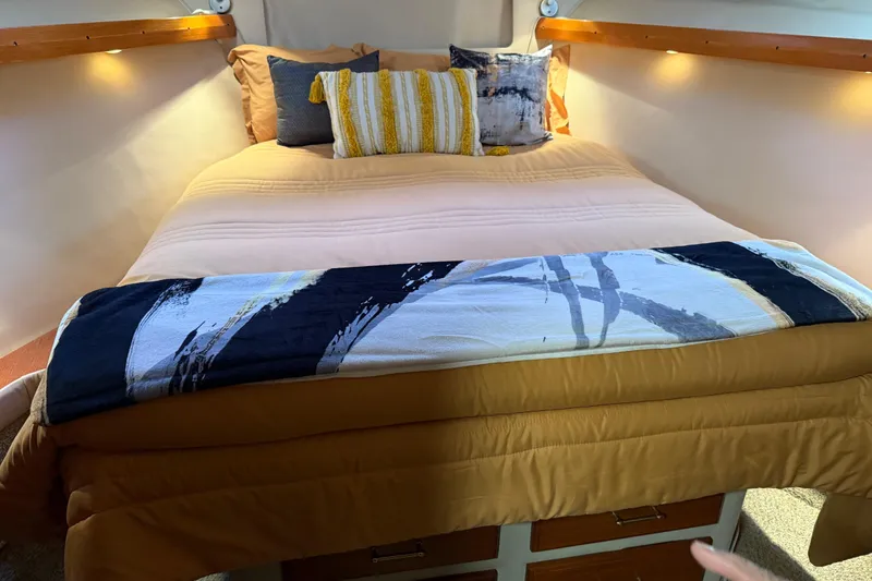 Slide: The Image of 1985 Bayliner 4550 Motoryacht kitchen with open wooden drawers and marble countertop. - 40