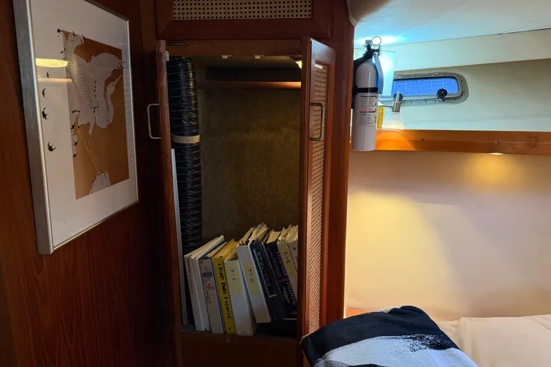 Slide: The Image of Cozy bedroom in 1985 Bayliner 4550 Motoryacht with modern decor and ambient lighting. - 42