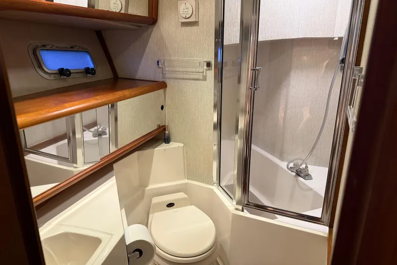 Slide: The Image of 1985 Bayliner 4550 Motoryacht interior with wooden closet and hanging life jackets. - 46