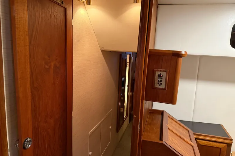 Slide: The Image of 1985 Bayliner 4550 Motoryacht interior cabin with bunk beds and wooden cabinetry. - 57