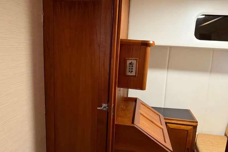 Slide: The Image of Interior storage compartment of 1985 Bayliner 4550 Motoryacht with window and light fixture. - 58