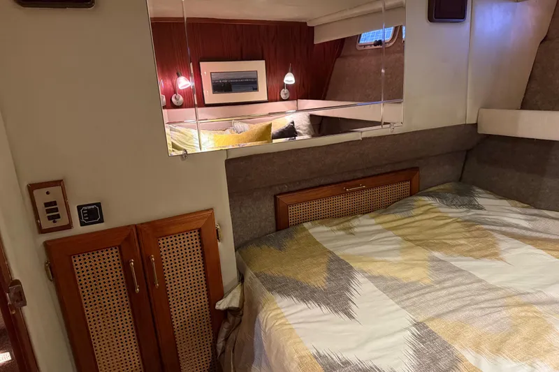 Slide: The Image of Interior of 1985 Bayliner 4550 Motoryacht with wooden cabinetry and modern paneling. - 60