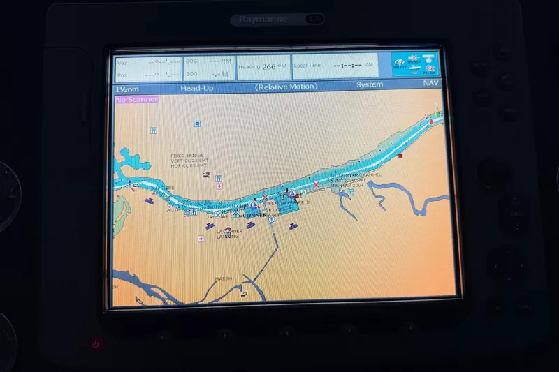 Slide: The Image of 1985 Bayliner 4550 Motoryacht helm with steering wheel and control panel. - 71