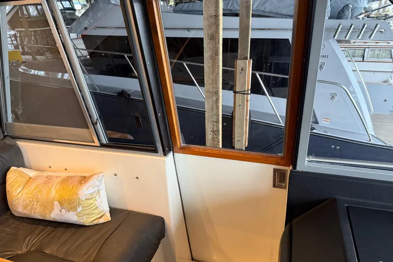 Slide: The Image of Interior of 1985 Bayliner 4550 Motoryacht with artwork and wooden cabinetry. - 82