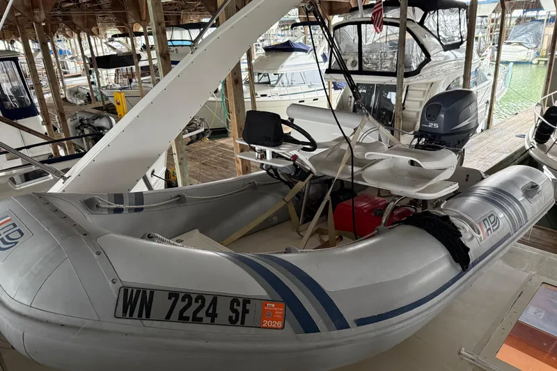 Slide: The Image of 1985 Bayliner 4550 Motoryacht interior with white cushioned seating area. - 96