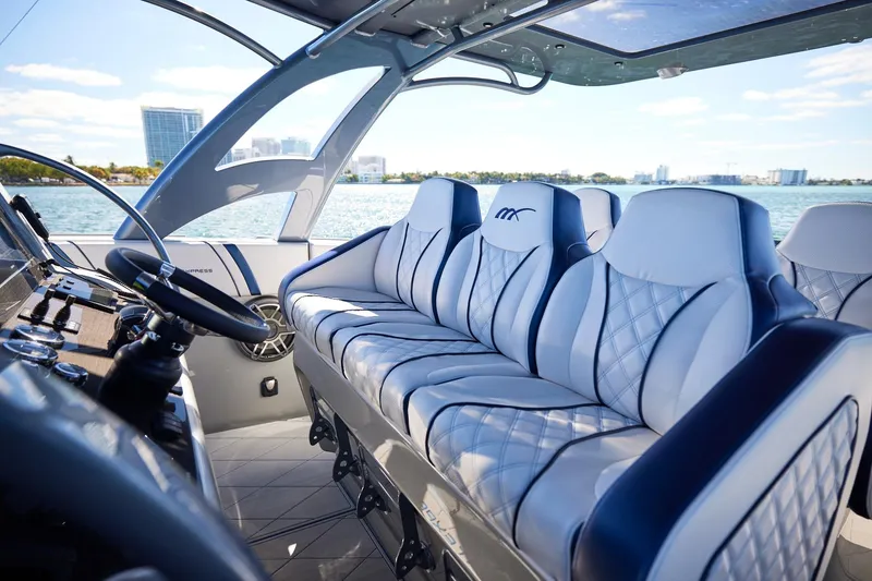 Slide: The Image of Luxurious interior of Midnight Express 43' Solstice boat with plush seating and modern controls. - 17