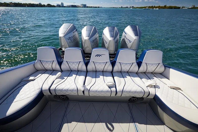 Slide: The Image of Luxury seating on Midnight Express 43' Solstice boat with powerful outboard engines. - 18
