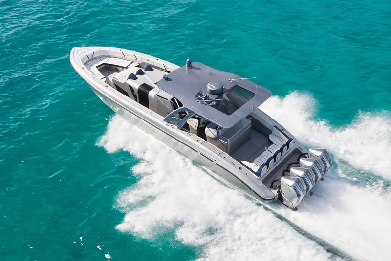 Slide: The Image of Luxury Midnight Express 43' Solstice boat cruising on turquoise waters. - 3