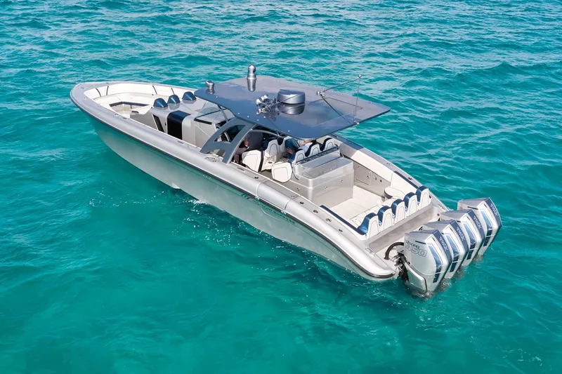 Slide: The Image of Midnight Express 43' Solstice boat cruising on clear turquoise water. - 5