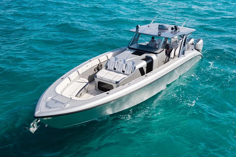 Slide: The Image of Midnight Express 43' Solstice boat cruising on clear blue ocean waters. - 6