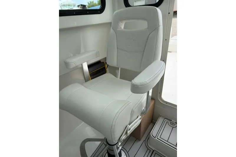 Slide: The Image of White captain's chair in 2026 Parker 227 Explorer boat interior. - 11