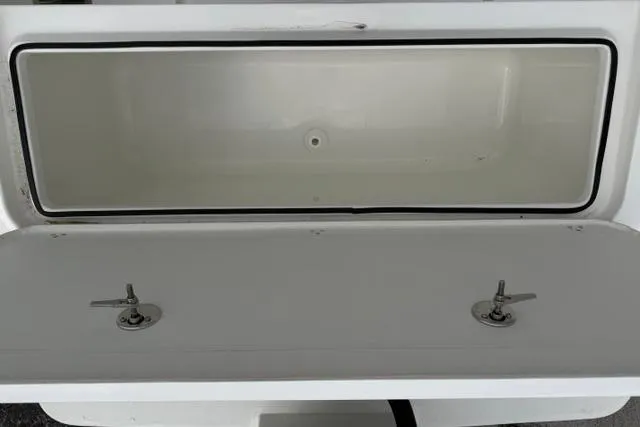 Slide: The Image of Open storage compartment on a 2026 Parker 227 Explorer boat. - 16