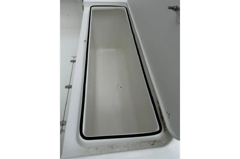Slide: The Image of Storage compartment of 2026 Parker 227 Explorer boat, open and empty. - 18