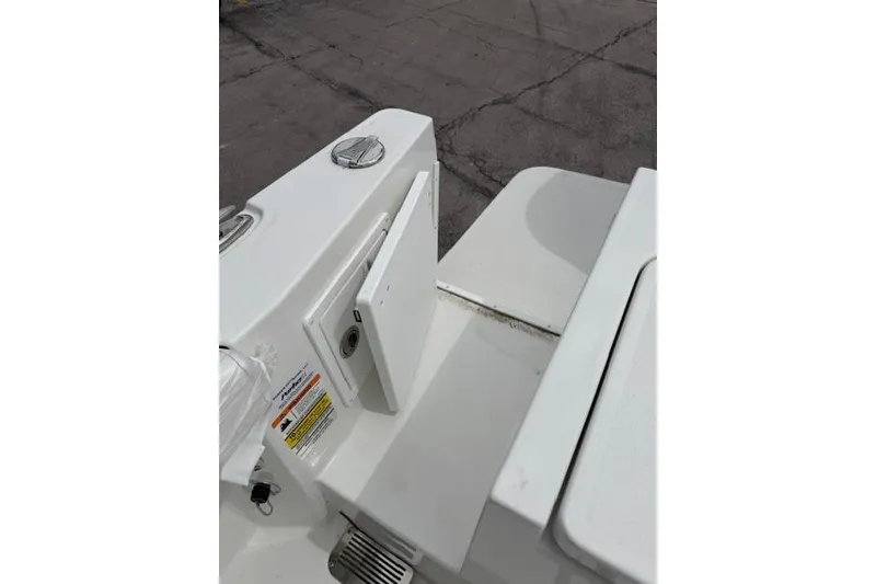 Slide: The Image of Parker 227 Explorer 2026 boat deck with storage compartment and safety labels. - 19