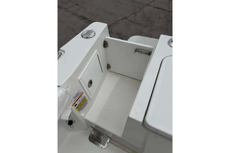 Slide: The Image of 2026 Parker 227 Explorer boat interior with storage compartment and hatch. - 20