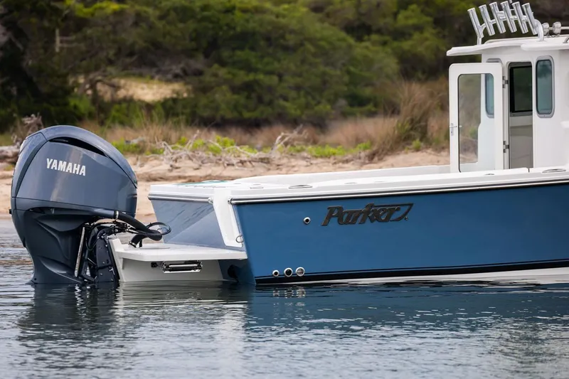 Slide: The Image of Manufacturer Provided Image: 2026 Parker 227 Explorer boat with Yamaha engine on calm water. - 5