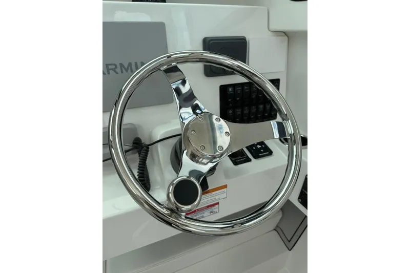 Slide: The Image of Steering wheel of 2026 Parker 227 Explorer boat, featuring modern controls and sleek design. - 9