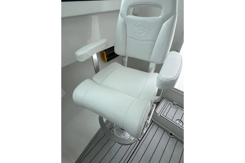 Slide: The Image of White captain's chair on 2026 Parker 247 Explorer boat, featuring armrests and sleek design. - 11