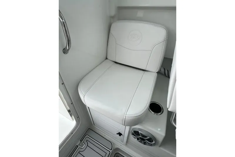 Slide: The Image of 2026 Parker 247 Explorer boat interior seat with cup holder and speaker. - 13