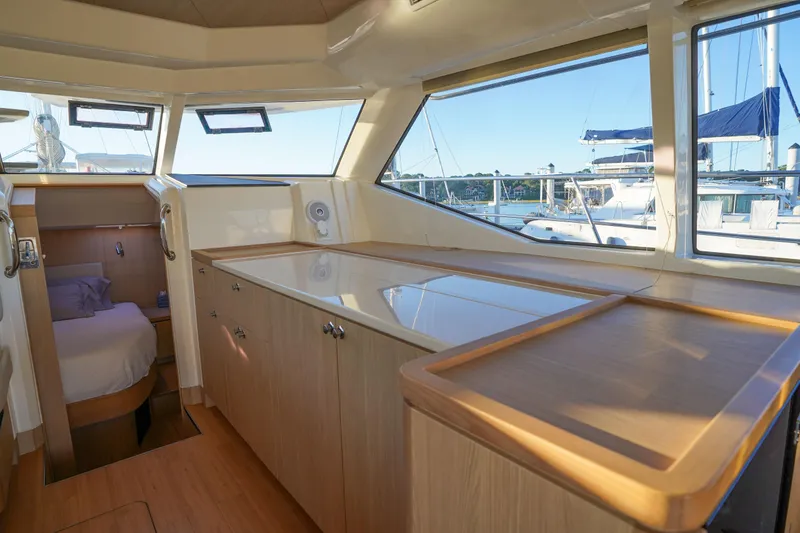 Slide: The Image of Interior of 2021 Aquila 44 Yacht with spacious cabin and panoramic windows. - 12